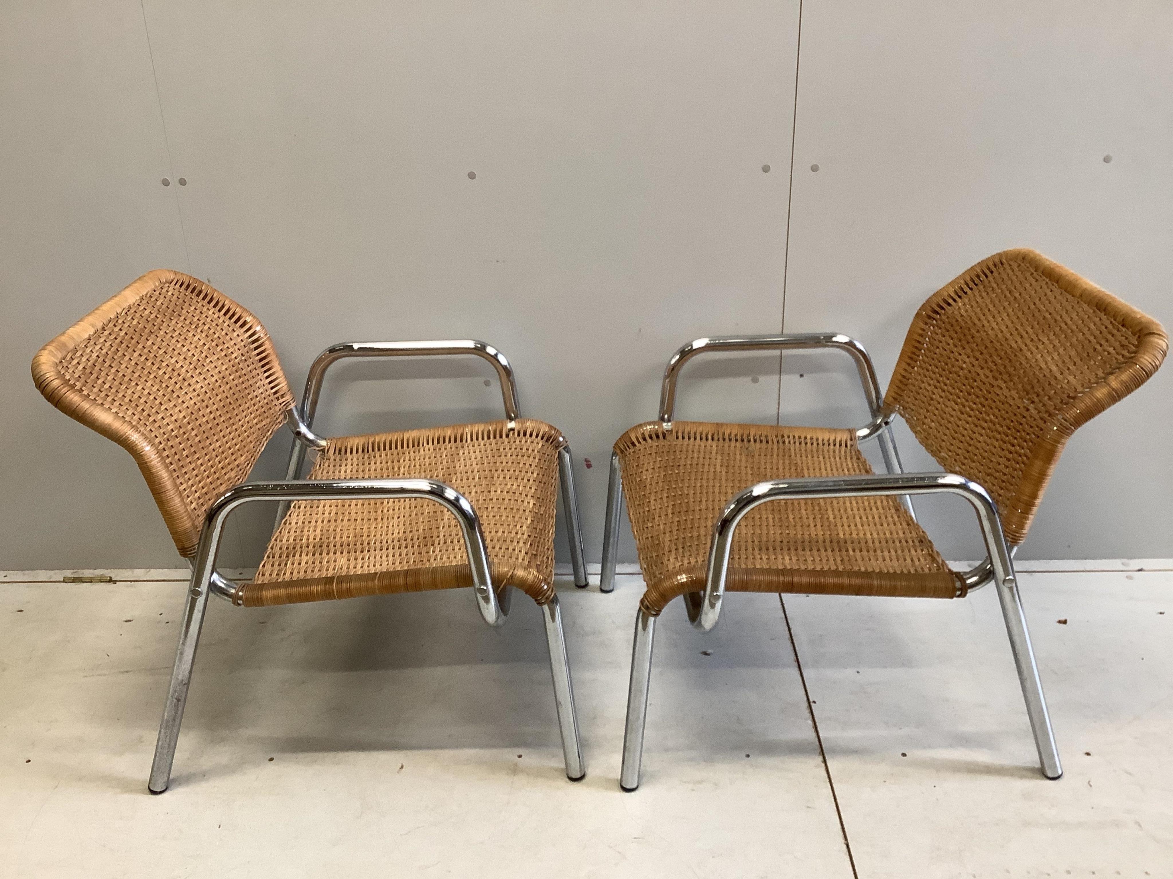 A pair of modern cane garden chairs, width 66cm, depth 56cm, height 78cm. Condition - fair